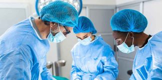 Surgeons performing an operation in a sterile environment