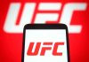 UFC logo on phone screen and background.