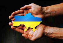 Top Ukraine Officials Resign: Corruption Scandal Erupts Hands holding Ukraine map with flag design.