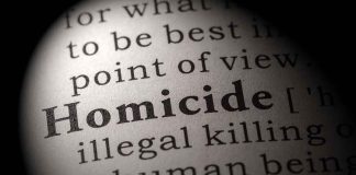 Magnified text showing definition of homicide.