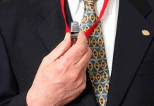 Brutal Superstore Raid—Whistleblower FIRED Instantly Person holding a whistle on a red lanyard