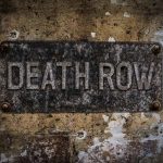 Weathered Death Row sign on aged concrete wall
