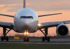 Unhinged Passenger Causes Emergency Landing Airplane on runway during sunset.