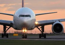 Unhinged Passenger Causes Emergency Landing Airplane on runway during sunset.