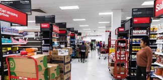 Interior of a grocery store with shelves filled with products and shoppers