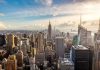 Aerial view of New York City skyline featuring the Empire State Building at sunset