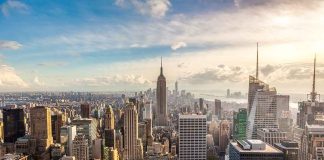 Aerial view of New York City skyline featuring the Empire State Building at sunset