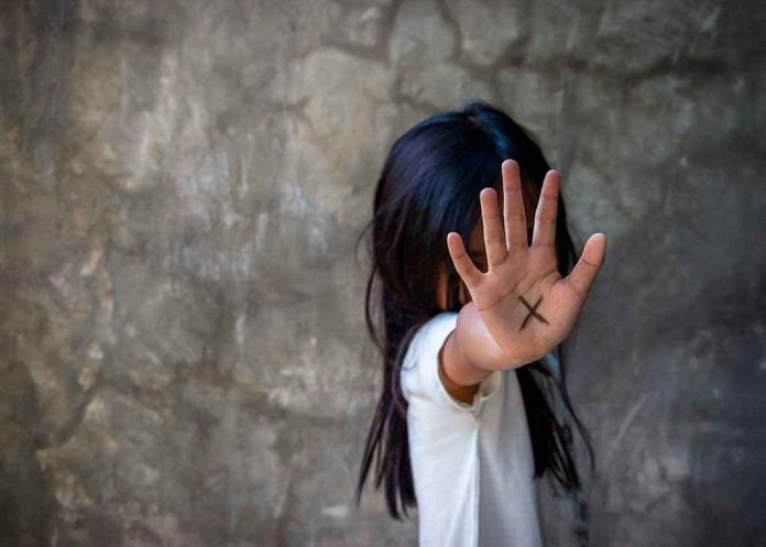 1090916351 Person with an X on their palm.