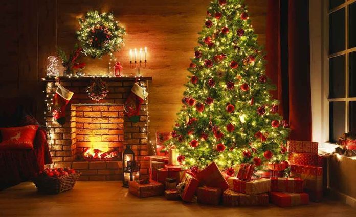 1552736867 Christmas tree and fireplace with stockings and gifts.