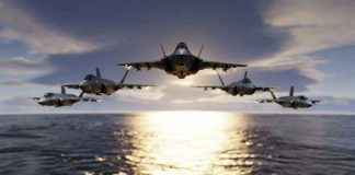 Five jets flying low over the ocean at sunset.