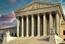 Court REJECTS WH Request on Immigration Judges Building with columns and statues in front of entrance.