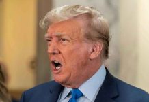 Shocking GOP Split: Trump Rejected Man in suit with open mouth, speaking passionately.