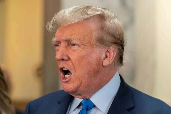 2369816081 Man in suit with open mouth, speaking passionately.