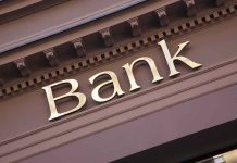 Epstein Case: Did Banks Cover for Epstein? Gold bank sign on building facade