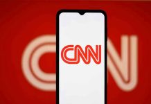 Is This the END of CNN? CNN logo on a phone screen.