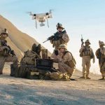 Special Forces Shock: Robots Take Command Soldiers operating a drone in a desert environment.