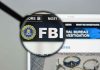Pipe Bomb Confession Stuns Capitol FBI website shown through magnifying glass.
