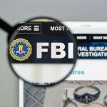 Pipe Bomb Confession Stuns Capitol FBI website shown through magnifying glass.