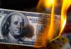 Lavish Spending by Jasmine Crockett Under Fire Burning hundred-dollar bill with visible flames.