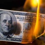 Lavish Spending by Jasmine Crockett Under Fire Burning hundred-dollar bill with visible flames.