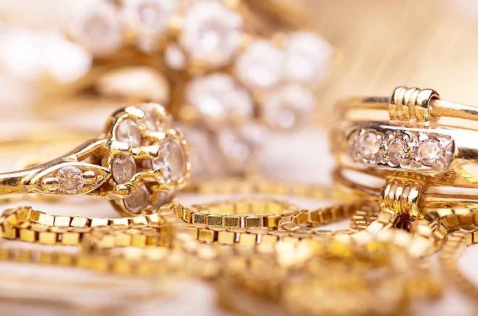 shutterstock_225498538.jpg Close-up of various gold rings adorned with sparkling gems