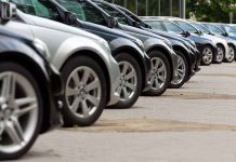 Major Auto Manufacturer DROPPING Electric Vehicles A row of parked black and silver cars in a dealership