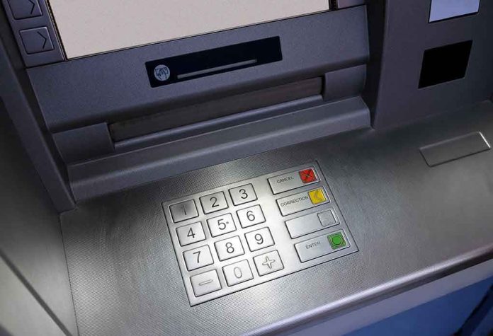 Close-up of an ATM keypad with numeric buttons and function keys