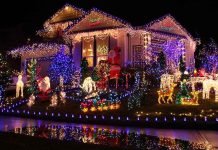 Brussels MODERNIZED Christmas–Sparked FURY! A house decorated with colorful Christmas lights and festive figures