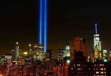 Outrage Over 9/11 Memorial Lighting Choice New York City skyline at night with memorial lights.