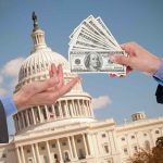 Why Fed Isn’t Cutting Rates Yet Hands exchanging money in front of Capitol building.