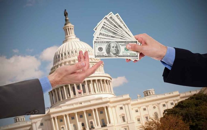 Hands exchanging money in front of Capitol building.