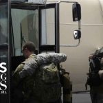 Tensions flare as Trump surges military assets and Iran warns