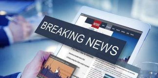 Breaking news on a digital tablet screen.