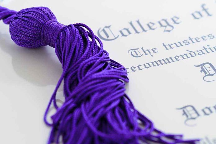 Close-up of a purple graduation tassel next to a diploma