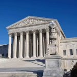 Pope’s Alleged Cover-Up Sparks Outrage The Supreme Court building with large columns and a clear blue sky