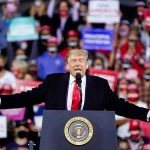 Millions Of Christians Have Been Waiting To Hear This Person speaking at a podium during a rally.
