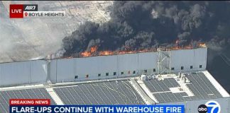 Local emergency declared as Boyle Heights warehouse fire flare-ups persist, smoke drifts beyond area