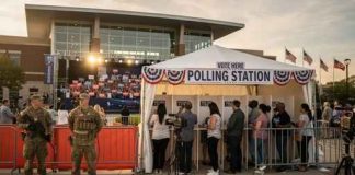 Polling station with military personnel and voters in line