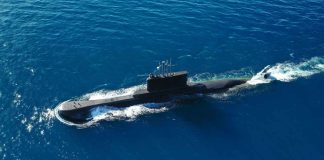 Submarine sailing on the ocean surface