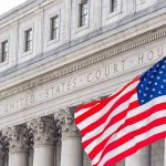 Instagram Rant Triggers FBI Pile-On United States courthouse with American flag waving.