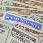 Social Security Time Bomb Hits Defense A social security card placed among various denominations of US currency
