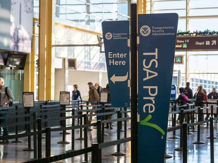 shutterstock_1549154468 TSA PreCheck sign at airport security