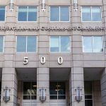 Border Czar Defends Killing US government building facade with flags and number 500