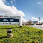 Tariff Hammer Drops: Canada Hit 50% Canada border inspection sign at roadside checkpoint