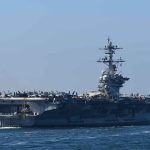 Aircraft carrier cruising at sea
