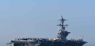 Aircraft carrier cruising at sea