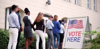 voters standing in line outside a polling place