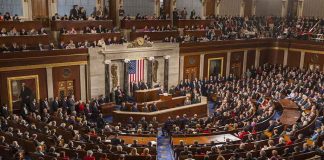Legislative chamber filled with attendees during a formal address