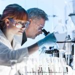 CO2 Blasts Flush Alzheimer’s Gunk Scientists working in a laboratory with protective goggles and gloves