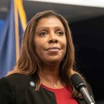 Woman speaking at a press conference microphone